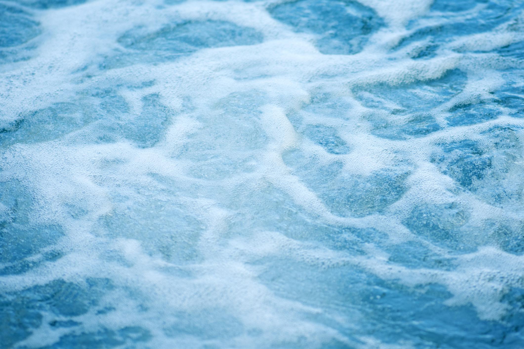 the appearance of foam on the water surface